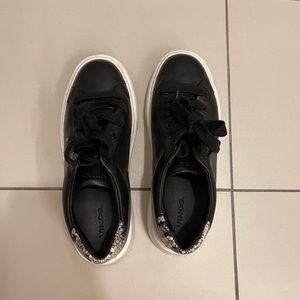 Black chunky soled casual sneakers, with animal print accent